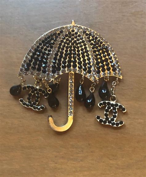 chanel umbrella brooch|Chanel brooches no 5.